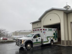 Ambulance departing garage bay